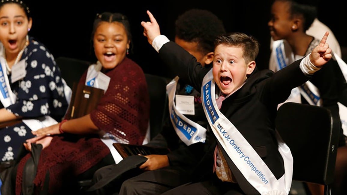 Wesley Stoker celebrates after being announced as the winner of the 26th Annual Gardere MLK Jr. Oratory Competition